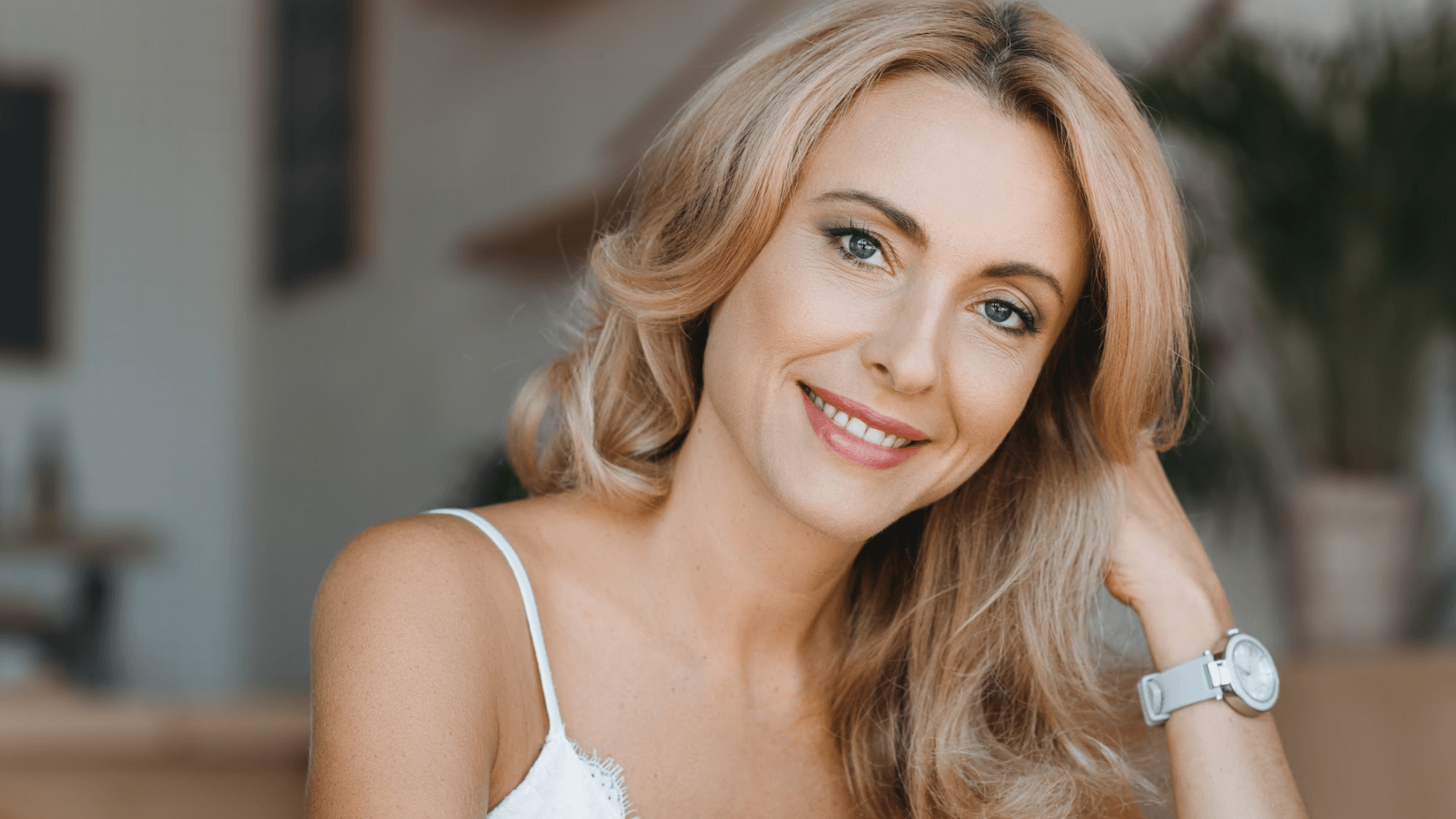 blonde woman smiling inside